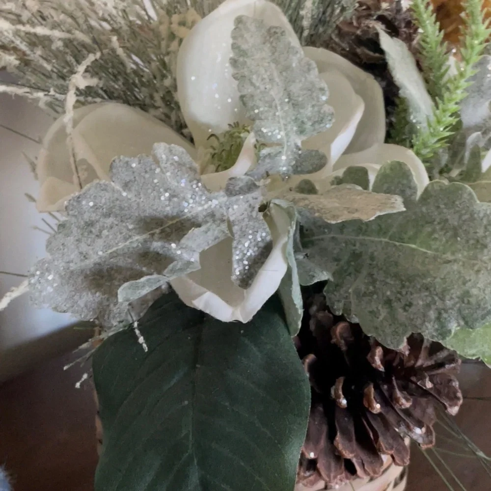 Winter hanging basket floral decor pinecones white flowers pine needles wreath